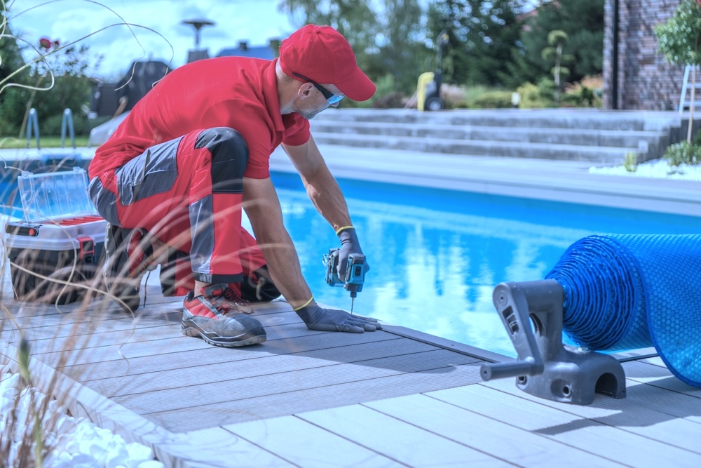 Composite deck contractor installing pool deck boards