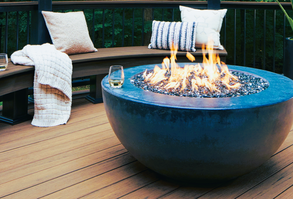 Composite deck resembling wood with a fireplace