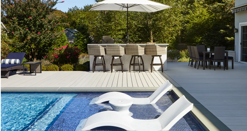 Pool deck with white composite decking material